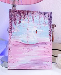 a painting of a white swan on a pink background