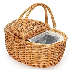 a wicker basket with two towels in it