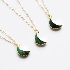 "*PRODUCT DETAIL* ✧ Moon shaped natural emerald gemstone necklace ✧ Available in gold filled chain. ✧ Pendant : 13mm, Gold plated ✧ Double wrap chain option: It's longer version of the chain that's designed to give extra wrap around your neck. Ex: Pendant of 29\" chain is designed to fit as 14.5\" length of necklace after it's wrapped around your neck. *Crescent gemstone options* -AMETHYST (February birthstone) -AQUAMARINE (March Birthstone) -EMERALD (May birthstone) -MOONSTONE (June birthstone) Green Necklace With Moon Charm, Green Moon Charm Round Necklace, Green Moon Charm Necklace, Jade Birthstone Necklace For May, May Jade Birthstone Necklace, Gift Crescent Gemstone Crystal Necklaces, Crescent Gemstone Crystal Necklaces For Gifts, Green Natural Stone Charm Necklace For Gift, Green Crescent Moon Charm Jewelry