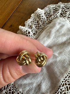 This is a beautiful set of vintage gold knot earrings. The earrings are 14 karat gold double rope circular knots attached via a post setting and push back closure.  These are simple yet beautiful gold accessory for anyone! This vintage item has been used, but is great condition.  Gold jeweler verified. Dimensions: Diameter - 3/8"  Doily not included. Recycled items may be used in packing/shipping of items from my shop. My goal is to provide my customers with their desired product in the conditio Gold Knot Earrings, Rope Jewelry, Nautical Rope, Recycled Items, Knot Earrings, Gold Accessories, Jewelry Earrings Studs, Vintage Gold, Post Earrings