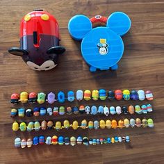 some toys are laying on the floor next to it's packaging and instructions for making mickey mouse ear hats