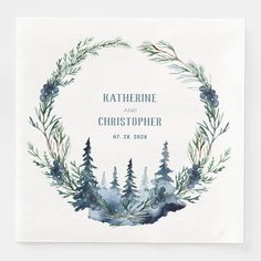 a watercolor wreath with pine trees on it