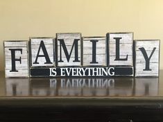 wooden blocks spelling family is everything on a table