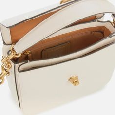 Make an elegant statement with the ‘Cassie’ cross body bag, by creator of luxurious leather goods, Coach. Fully-structured, the bag comes with a detachable strap that allows the wearer to carry the bag by hand, secured with gold-toned dog clips. A detachable over-the-shoulder strap is included, complementing the gold-hued branded hardware on the envelope-style flap and the eye-catching leather label attachment at the side of the bag. Opening the bag reveals a spacious inside, featuring a convenient zip-fastening pocket for essentials and supple branded lining. Finished with turn-lock closure. Leather Dimensions: H: 16.5cm x W: 19.9cm x D: 8.5cm. Strap Drop: 54cm. Coach Crossbody Satchel With Adjustable Strap, Pebbled Leather Crossbody Bag With Detachable Strap, Pebbled Leather Crossbody Satchel With Adjustable Strap, Crossbody Satchel With Detachable Strap In Pebbled Leather, Crossbody Pebbled Leather Satchel With Detachable Strap, Pebbled Leather Crossbody Satchel With Detachable Strap, Pebbled Leather Crossbody Shoulder Bag With Detachable Strap, Coach Satchel With Gold-tone Hardware And Top Handle, Coach Top Handle Satchel With Gold-tone Hardware