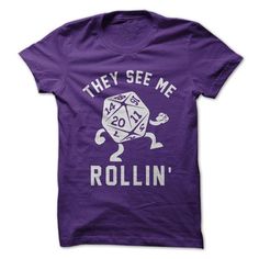 a black t - shirt that says they see me rollin '