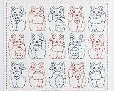 a cross stitch pattern with cats in different sizes and colors on white paper, including red thread