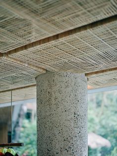 a close up of a pillar near a window