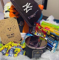 an assortment of candy and other items on a bed