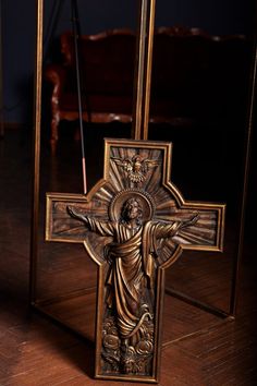 an ornate wooden crucifix with the image of jesus on it's cross