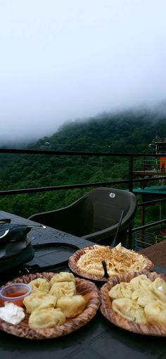 two plates of food sitting on top of a table