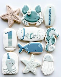 decorated cookies with sea animals and seashells on them