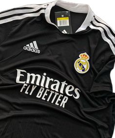 an adidas jersey with the real madrid logo on it