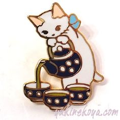 a white and black cat sitting on top of a pot filled with water in it's paws