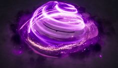 a purple spinning object in the dark