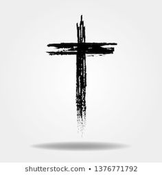 the cross is painted with black paint on a white background, and it appears to be an artistic piece of art