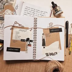 an open notebook with pictures on it next to some crafting supplies and other items