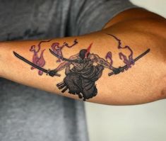 a man with a tattoo on his arm holding two swords