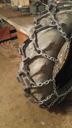 a large tire with chains attached to it