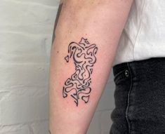 a person with a tattoo on their arm