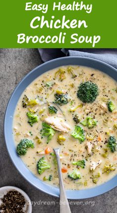 broccoli and chicken soup in a blue bowl with a spoon next to it