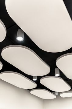 the ceiling is covered with white circular lights