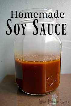 homemade soy sauce in a glass jar sitting on a counter with the words homemade soy sauce above it