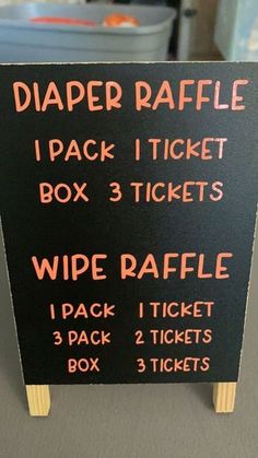 a sign with instructions for diaper raffle