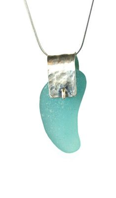 a necklace with a piece of sea glass on it