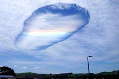 a cloud shaped like a heart in the sky