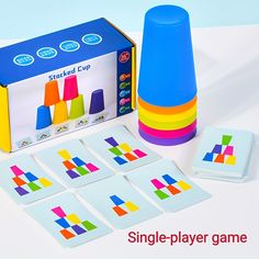 the game is set up to be played with colored blocks and matching cups, which are also used by children