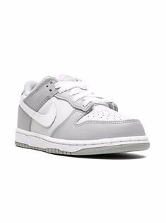 Grey/white leather Dunk Low sneakers from NIKE KIDS featuring signature Swoosh logo detail, embroidered logo to the rear, two-tone design, round toe, front lace-up fastening, logo patch at the tongue, branded insole and rubber sole. These styles are supplied by a premium sneaker marketplace. Stocking only the most sought-after footwear, they source and curate some of the most hard to find sneakers from around the world.. | Nike Kids Dunk Low sneakers Nike Dunks Kids, Cute Shoes For School Nike, Dunk Low Pure Platinum, Nike Shoes Kids, Nike Air Dunk, Shoes Dunks, Dunk Lows, Sneakers Kids, Trendy Shoes Sneakers