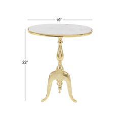 a gold table with a white marble top and an ornate design on the base, measurements for