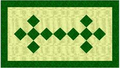 a green and white quilt with squares on the bottom, and an argyle pattern in the middle