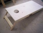 a wooden table with a hole in it