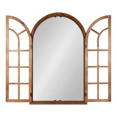 an arched wooden mirror on a white background