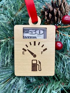 a wooden ornament with a gas pump on it