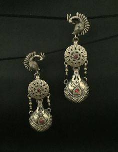 Handmade item (Earring-Jhumki) Materials:  Silver  Style: Traditional Description:-  Antique silver 925, 18K Gold Plated, Gemstone Engagement , Anniversary , Honeymoon, First Date for Women, Traditional Earring - Jhumki , Gift for Her Metal :- SOLID 925 sterling silver  Weight- 35 grams apx ( Earrings are same as shown in the pictures. We have only one piece in this style and colour, hence you get what you see in the picture ) Package - Individual gift wrapped box How to care:- The sterling material itself is soft, this ring band is thin, please avoid any serious collision and squeezing, because this may make the ring bent or stone fall out, we recommend you to buy a larger half size ring to make finger loose, this will avoid any squeezing. Handmade Jewelry By Vidita Jewels Contact us if a Silver Fusion Style Drop Jhumkas, Silver Chandbali Fusion Earrings, Silver Dangle Temple Jewelry Earrings, Elegant Sterling Silver Earrings With Peacock Design, Elegant Sterling Silver Earrings For Festivals, Elegant Sterling Silver Danglers For Festivals, Peacock Design Dangle Earrings For Gift, Silver Chandbali Temple Earrings, Elegant Oxidized Finish Festive Earrings