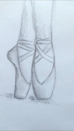 a pencil drawing of a pair of ballet shoes on a white paper background, with the bottom part of the shoe visible