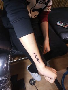 a person with a small tattoo on their foot