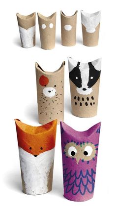 four different colored paper cups with animals painted on the sides and one has an owl, fox, and raccoon face