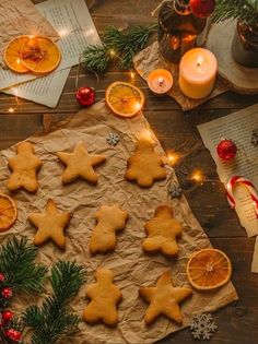 christmas cookies and orange slices on a table