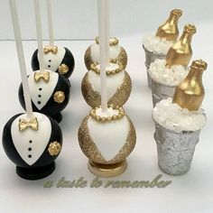 there are some cake pops decorated with gold and white decorations