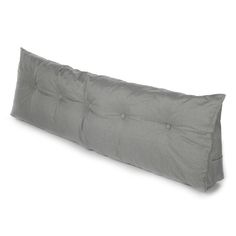 a long gray pillow with buttons on the back and sides, sitting against a white background