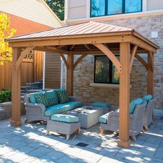 a wooden gazebo sitting on top of a brick patio