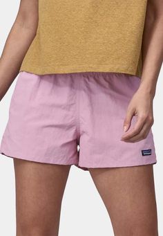 Patagonia women's barely baggies shorts - milkweed mauve    patagonia is so good at what they do i don't even know where to start. since it's inception in 1973 founder yvon chouinard has ensured the company's commitment to environmental conservation has remained at the forefront of it's mission. patagonia leads the way in ethical manufacturing practices.    sizing: regular - shop to size  materials: 100% recycled nylon    - durable water repellent (dwr) finish  - 2½ inch inseam  - elastic waistb Patagonia Shorts, Shorts Women, Denim Leggings, Shorts With Tights, Workout Accessories, Patagonia Womens, Shorts Athletic, Denim Pant, Tight Leggings