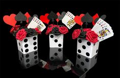 four dices with playing cards and roses in them