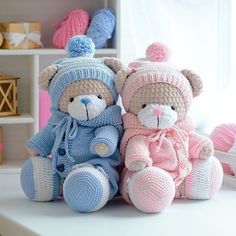 two crocheted teddy bears sitting next to each other