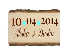 a wooden sign with the date and heart on it