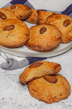 several cookies on a plate with one cut in half