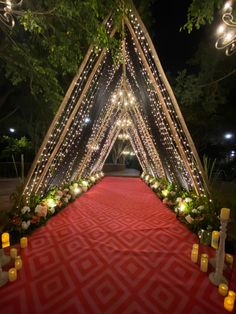 a red carpet with candles and lights on it